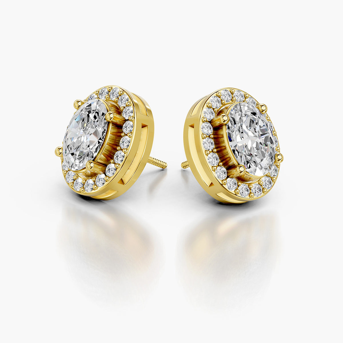Round diamond solitaire stud earrings in yellow gold