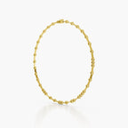 A yellow gold tennis bracelet with a distinctive beaded, linked design, displayed in an oval shape against a clean white background.