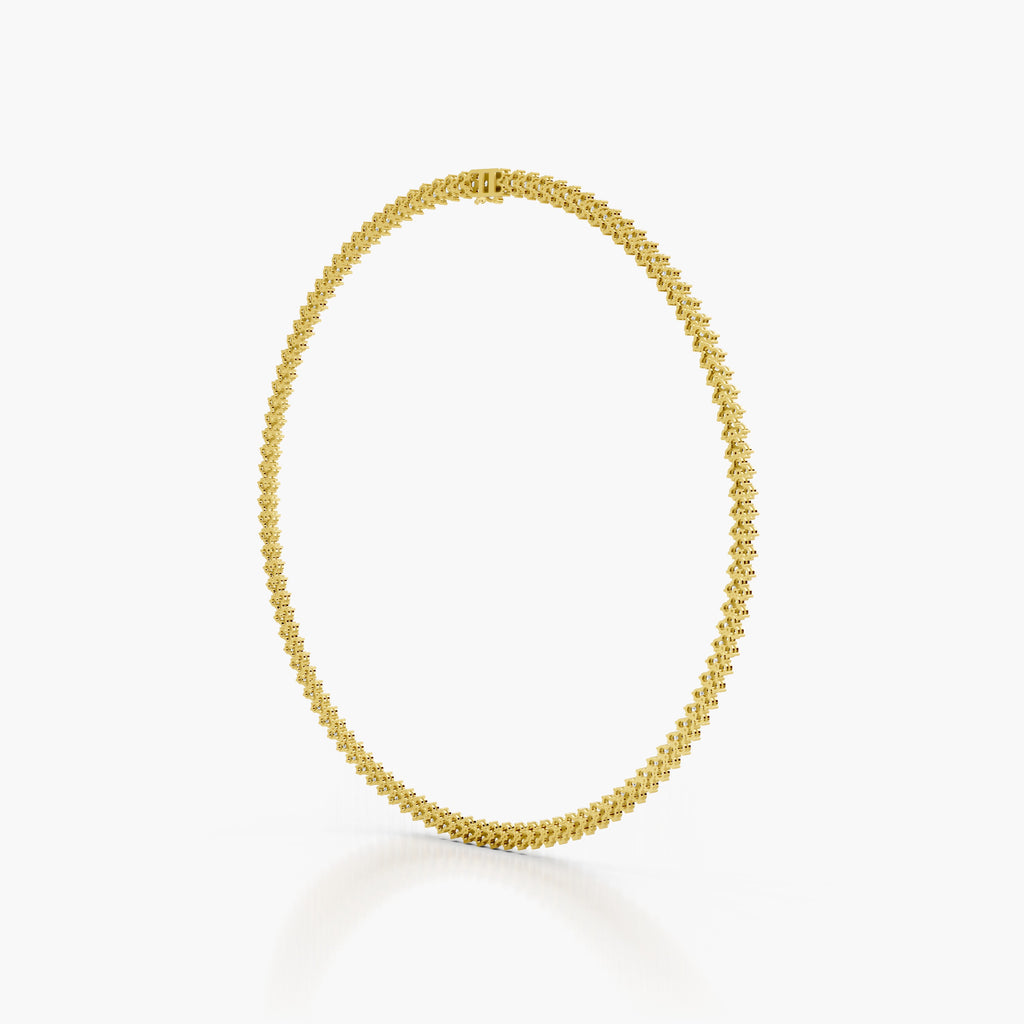 A delicate pearl necklace with a small gold clasp, displayed in a circular shape against a clean white background.