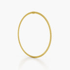 A delicate pearl necklace with a small gold clasp, displayed in a circular shape against a clean white background.